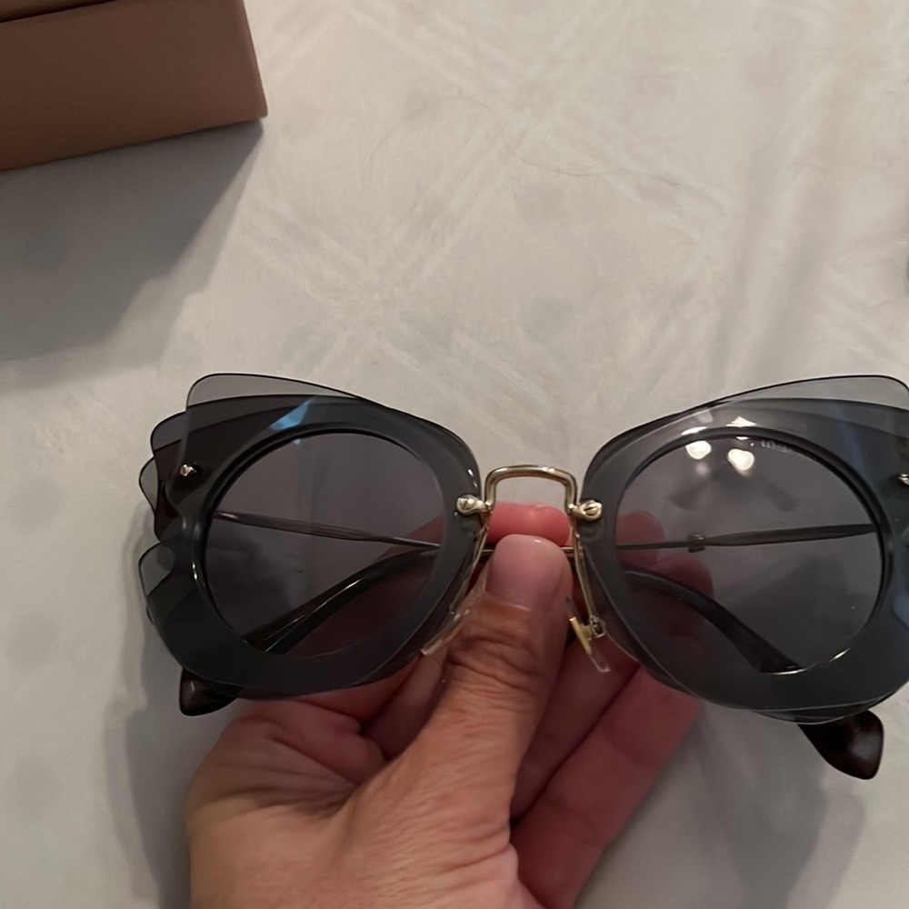 Sunglasses, has light tone of grey and black. New box, case, cleanse cloth NWOT